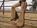 Leather Western show chaps by Haram Exports, featuring durable black leather with decorative stitching and silver accents.